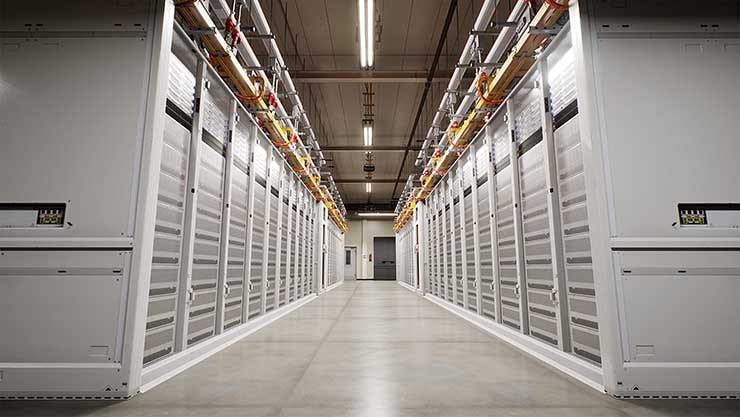 A long row of racks and servers inside a Microsoft Azure cloud data center. (Image: Microsoft)