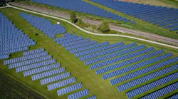 A large array of photovoltaic solar panels. (Photo by Andreas Gücklhorn on Unsplash)