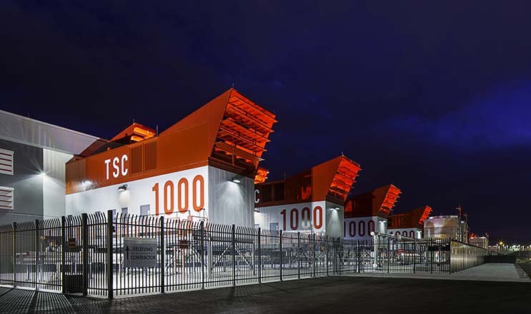 The exterior of the SUPERNAP data center in Las Vegas, with the exterior cooling units framed by the sky. (Photo: Switch)
