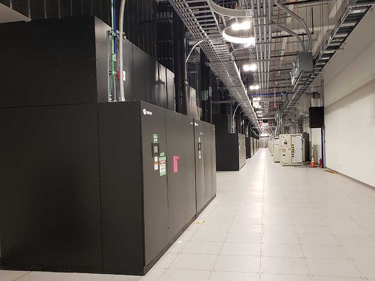 Power and cooling equipment in a gallery running alongside a data hall in the QTS Shellhorn DC-1 data center. (Photo: Rich Miller)