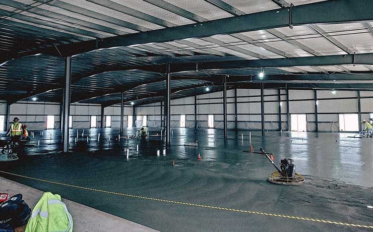 A low-carbon concrete formula is poured at the DeKalb data center location in the construction personnel office space. (Photo: Meta)