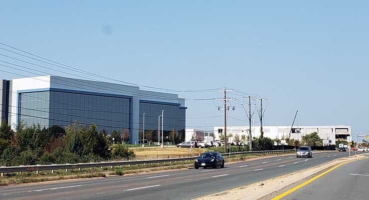 Two huge new data centers in Ashburn, Virginia, built by Digital Realty (left) and CloudHQ. (Photo: Rich Miller)