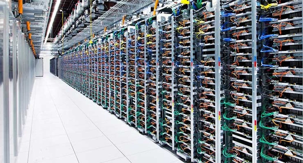 A long row of racks housing servers inside the Google data center in Mayes County, Oklahoma. (Photo: Google)