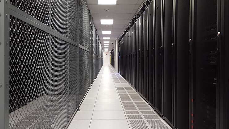 A row of cabinets and a colocation cage in a TierPoint data center in Pennsylvania. (Photo: Rich Miller)