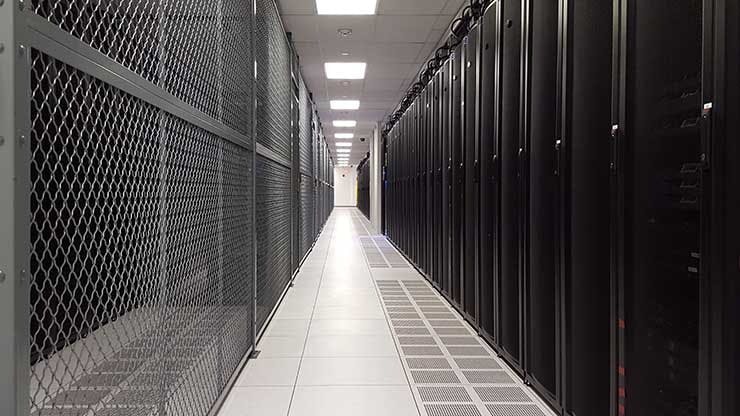 A row of cabinets and a colocation cage in a TierPoint data center in Pennsylvania. (Photo: Rich Miller)