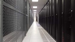 A row of cabinets and a colocation cage in a TierPoint data center in Pennsylvania. (Photo: Rich Miller)