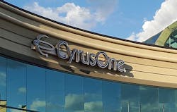The CyrusOne logo, framed by clouds, on one of the company’s data centers. (Photo: Rich Miller) The CyrusOne logo, framed by clouds, on one of the company’s data centers. (Photo: Rich Miller)