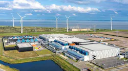 The Google data center campus at Eemshaven in the Netherlands, with nearby wind turbines in the background. (Photo: Google)