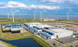 The Google data center campus at Eemshaven in the Netherlands, with nearby wind turbines in the background. (Photo: Google)