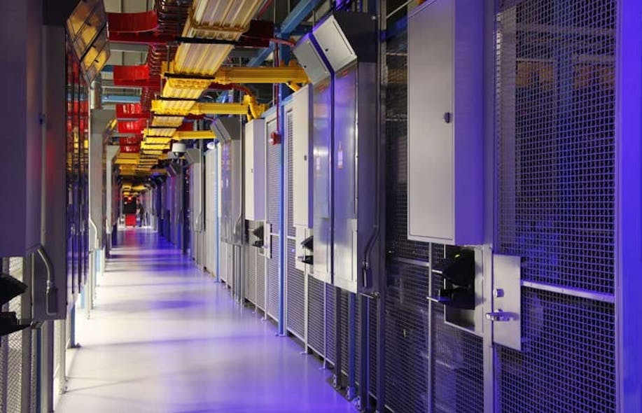 The distinctive blue-lit, cage-lined corridors inside an Equinix data center. (Photo: Equinx)