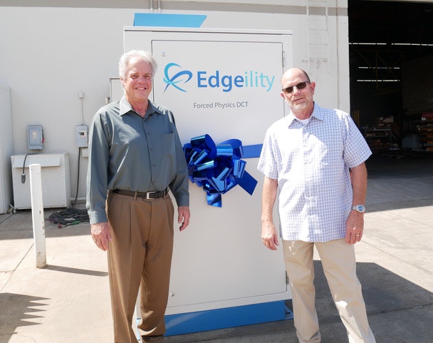 Forced Physics CEO and founder Scott Davis (left) with Phil McCoy, President of of Sun West Engineering and the new Edgeility module for edge computing. (Photo: Forced Physics)