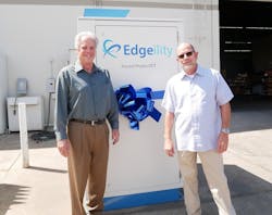 Forced Physics CEO and founder Scott Davis (left) with Phil McCoy, President of of Sun West Engineering and the new Edgeility module for edge computing. (Photo: Forced Physics)