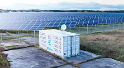 A cryptocurrency mining module next to a solar power array. (source: BusinessWire)