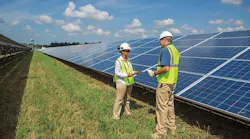 Workers inspect photovoltaic panels at a Dominion Energy solar generation facility in Virginia. (Photo: Dominion Energy)