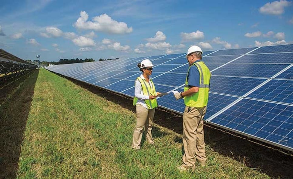 Workers inspect photovoltaic panels at a Dominion Energy solar generation facility in Virginia. (Photo: Dominion Energy)