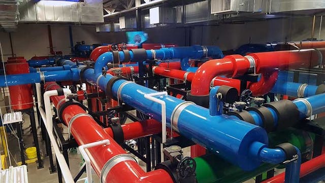 Massive color-coded pipes move water to and from the cooling equipment plant at the NTT Global Data Centers Americas campus in Sacramento, Calif. (Photo: RIch Miller)
