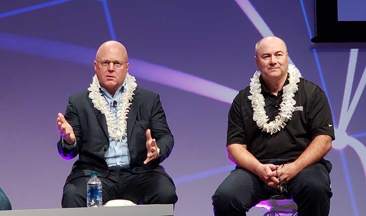 Peter Hopper of DH Capital (left) speaks at the recent PTC20 conference. Listening on at right is Lee Kestler from Vantage Data Centers. (Photo: Rich Miller)