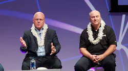 Peter Hopper of DH Capital (left) speaks at the recent PTC20 conference. Listening on at right is Lee Kestler from Vantage Data Centers. (Photo: Rich Miller)
