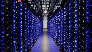A blue-lit row of servers in a Google data center, (Photo: Google)