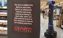 Marty (at right) is a robot that patrols the aisles of Giant Food Stores, using AI and computer vision to detect and report spills. (Photo: Rich Miller) Marty (at right) is a robot that patrols the aisles of Giant Food Stores, using AI and computer vision to detect and report spills. (Photo: Rich Miller)