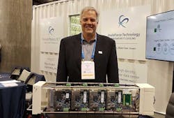 Forced Physics CEO and founder Scott Davis with a server assembly with servers attached to both sides of the Forced Physics JouleForce Conductor cooling unit. (Photo: Rich Miller)