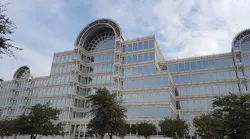 The glass facade of the Dallas Infomart, the leading carrier hotel and connectivity hub in Dallas, which was acquired by Equinix in 2018. (Photo: Rich Miller)