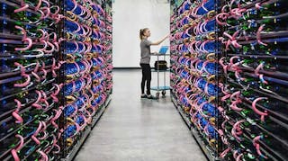 A row of racks filled with Google&rsquo;s AI hardware, known as TPUs. (Photo: Google)