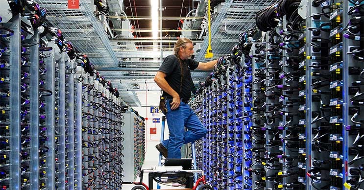 Google&rsquo;s Roger Harris performs maintenance on equipment in one of the company&rsquo;s data centers. (Photo: Google)
