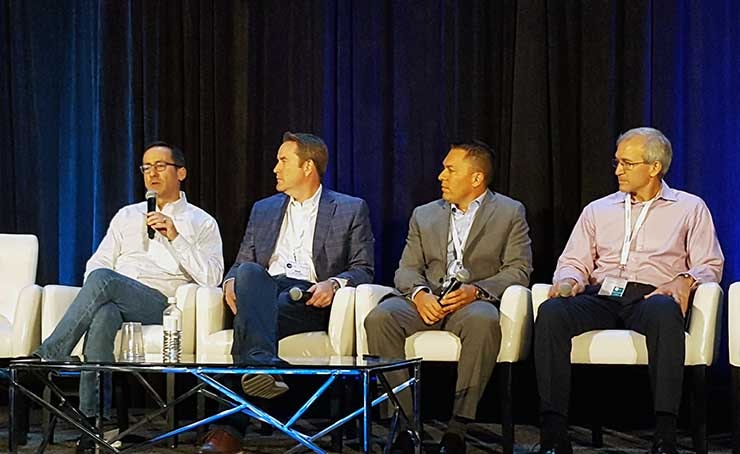 Jonathan Atkin of RBC Capital (at left) speaks on an investment panel at the Edge Congress in Austin. Other panelists (left to right) include Phil Kelley from Crown Castle, Christof Hammerli of Landmark Infrastructure, and DataBank CEO Raul Martynek. (Photo: Rich Miller)