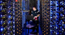 Google’s Denise Harwood replaces a CPU amid the blue-lit server-packed racks in the company’s data center in The Dalles, Oregon. (Photo: Google) Google’s Denise Harwood replaces a CPU amid the blue-lit server-packed racks in the company’s data center in The Dalles, Oregon. (Photo: Google)
