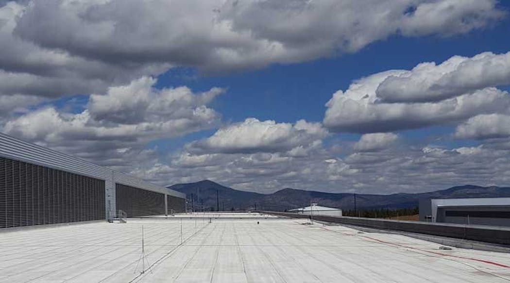 A horizon filled with clouds, rising above the mountains, and viewed from the roof of the Facebook data center in Prineville, Oregon &ndash; an example of the growing scale of cloud infrastructure. (Photo: Rich Miller)