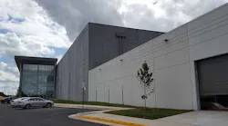 The front facade of Sterling V, showing the glass exterior on the three-story Class A office space. (Photo: Rich Miller)
