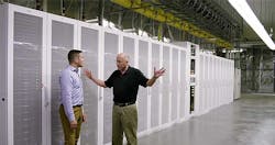 Microsoft’s Christian Belady (right) among the server aisles of the company’s newest data center in Quincy, Washington with Microsoft’s Alex Bradley, Visible behind Belady is a fan wall, one of the new wrinkles in the Generation 5 data center design. (Image: Microsoft) Microsoft’s Christian Belady (right) among the server aisles of the company’s newest data center in Quincy, Washington with Microsoft’s Alex Bradley, Visible behind Belady is a fan wall, one of the new wrinkles in the Generation 5 data center design. (Image: Microsoft)