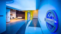 The lounge area at the entrance of the RagingWire VA2 data center in Ashburn, Virginia, featuring the logo for the NTT Nexcenter data center family. (Image: RagingWire)
