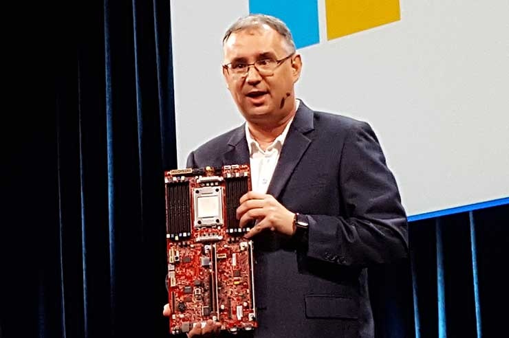 Leendert Van Doorn, a Distinguished Engineer at Microsoft, holds up an ARM motherboard during his keynote at the Open Compute Summit. (Photo: Rich Miller)