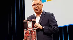 Leendert Van Doorn, a Distinguished Engineer at Microsoft, holds up an ARM motherboard during his keynote at the Open Compute Summit. (Photo: Rich Miller)