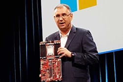 Leendert Van Doorn, a Distinguished Engineer at Microsoft, holds up an ARM motherboard during his keynote at the Open Compute Summit. (Photo: Rich Miller) Leendert Van Doorn, a Distinguished Engineer at Microsoft, holds up an ARM motherboard during his keynote at the Open Compute Summit. (Photo: Rich Miller)