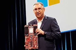 Leendert Van Doorn, a Distinguished Engineer at Microsoft, holds up an ARM motherboard during his keynote at the Open Compute Summit. (Photo: Rich Miller)