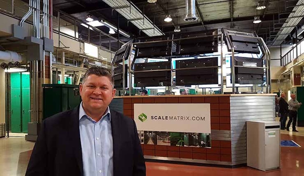 Chris Orlando, a co-founder of ScaleMatrix, in the company&rsquo;s San Diego data center and its distinctive central NOC. (Photo: Rich Miller)