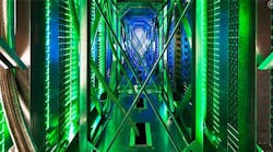 Inside the hot aisle of a Google data center, hundreds of fans funnel hot air from the server racks into a cooling unit to be recirculated. The green lights are the server status LEDs reflecting from the front of the servers. (Photo: Google) Inside the hot aisle of a Google data center, hundreds of fans funnel hot air from the server racks into a cooling unit to be recirculated. The green lights are the server status LEDs reflecting from the front of the servers. (Photo: Google)
