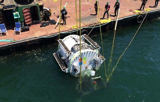 Microsoft&rsquo;s experimental underwater data center, the Leona Philpott, is lowered into the ocean in August 2015. (Photo: Microsoft Corp.)