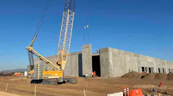 A pre-fabricated concrete section being hoisted into place during the construction of a Compass Datacenters campus. (Photo: Compass Datacenters)