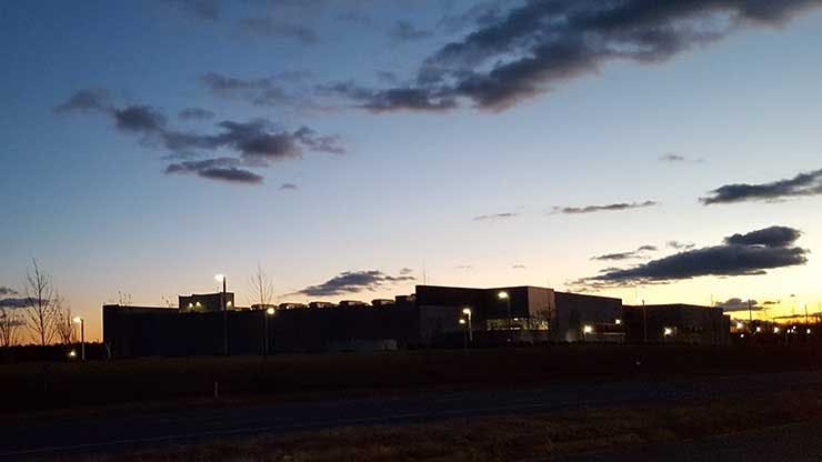The evening sun sets behind Building L, the massive new Digital Realty data center in Ashburn, Virginia. (Photo: Rich Miller)