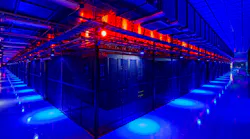 A vast data hall filled with racks of servers inside caged enclosures at the Switch campus in Las Vegas.