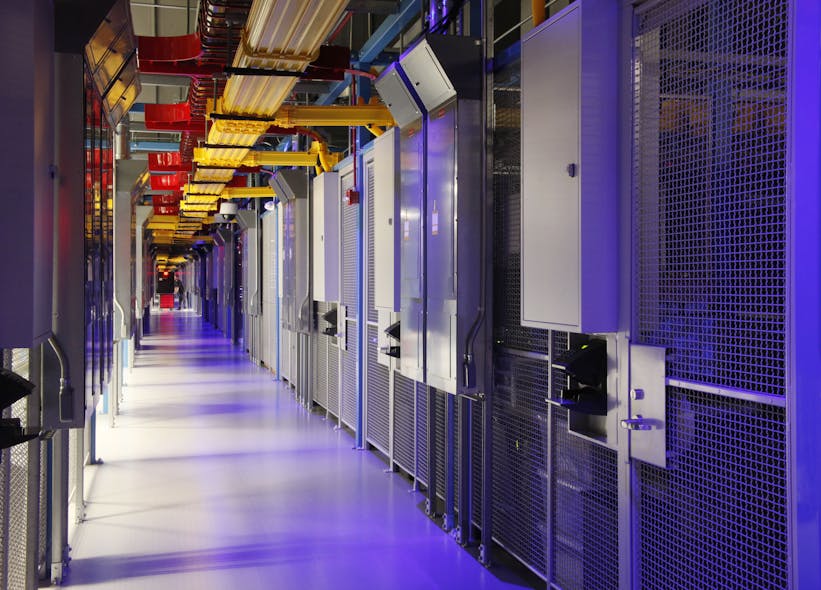 A corridor of cages housing colocation equipment inside an Equinix data center.