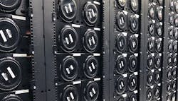 A row of Mac Pro computers housed in custom racks in a Mac Stadium data center. A row of Mac Pro computers housed in custom racks in a Mac Stadium data center.