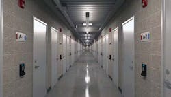 The corridor of the H5 Phoenix data center in Chandler, Arizona, showing the entrances to the dedicated data center suites.