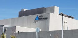 An Iron Mountain Data Centers building displays the company&rsquo;s iconic brand and logo inside a gated, high-security campus in Manassas, Virginia.