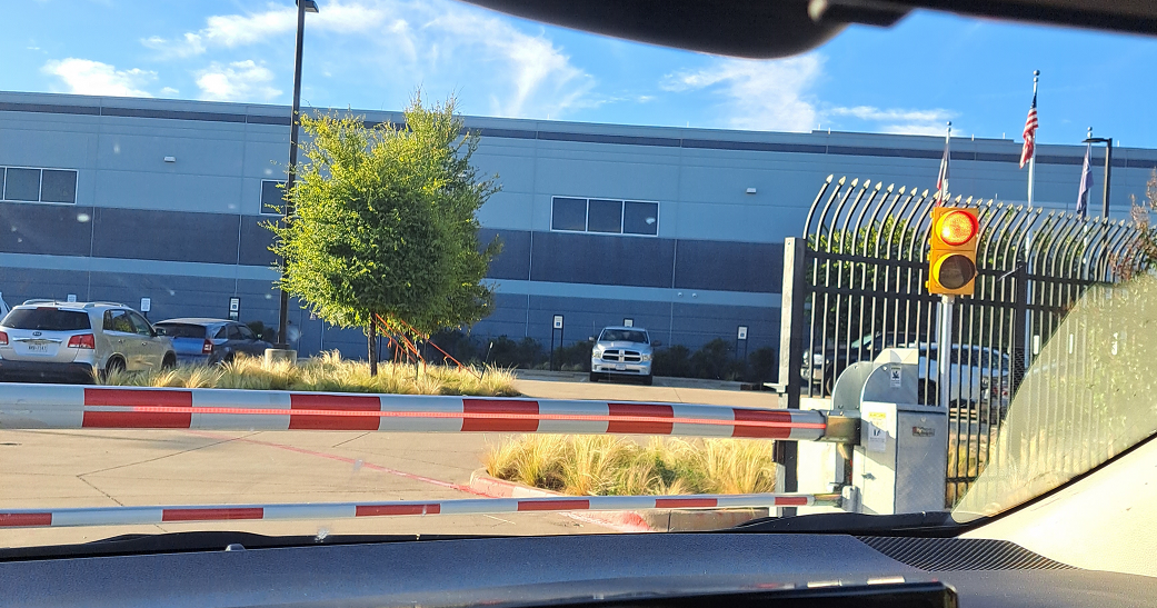 Rental car's eye view of entry into the Flexential Dallas-Plano Data Center at 3500 East Plano Parkway in Plano, Texas.