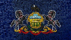 The flag of Pennsylvania here floats over over digital code, highlighting the concepts of AI and and digital infrastructure innovation within the state, which has become a burgeoning hot spot for hyperscale data center development. The flag of Pennsylvania here floats over over digital code, highlighting the concepts of AI and and digital infrastructure innovation within the state, which has become a burgeoning hot spot for hyperscale data center development.